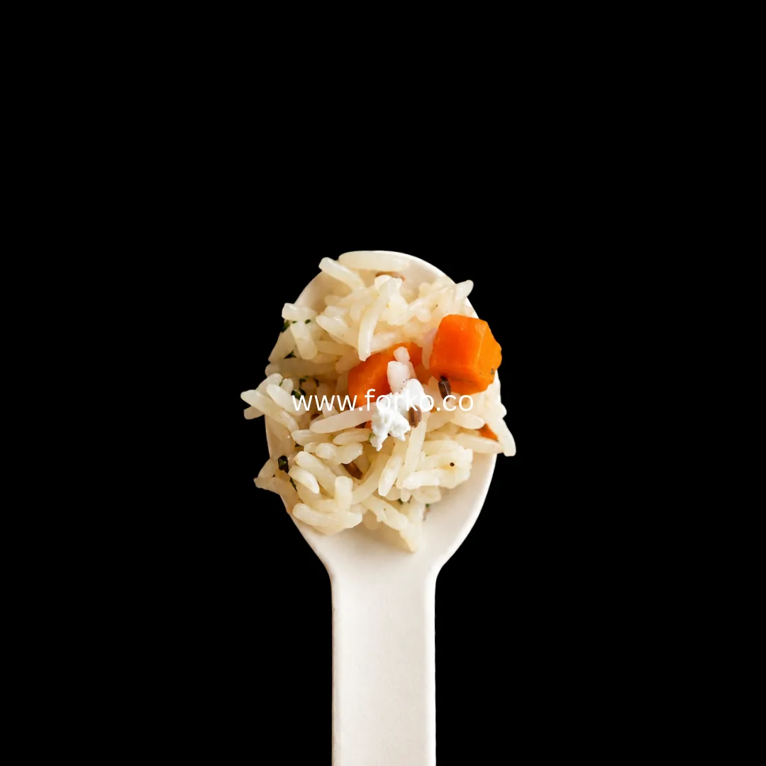 Paper spoon holding pulao rice with vegetables